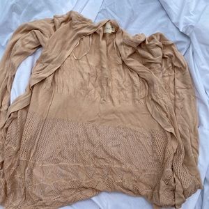 Cardigan sweater. Cute pattern in the stitching